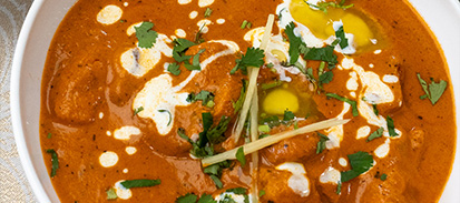 plate of spicy stir-fried beef with red chili peppers and herbs served in a bowl delicious Asian dish with rich sauce and flavor 4 ingredients classic recipe